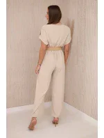 Kombinéza s ozdobným pásom béžová Kombinéza s ozdobným pásom béžová