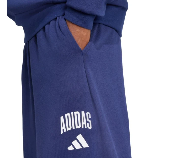 Pánske tmavomodré nohavice adidas Collegiate JM9179 Pánske tmavomodré nohavice adidas Collegiate JM9179
