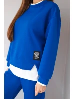 Dámský komplet s s volnou mikinou a tepláky modrý model 21808627 - K-Fashion Dámský komplet s s volnou mikinou a tepláky modrý model 21808627 - K-Fashion