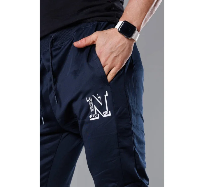Tmavě modré pánské teplákové kalhoty s potiskem model 18347905 - J.STYLE Tmavě modré pánské teplákové kalhoty s potiskem model 18347905 - J.STYLE