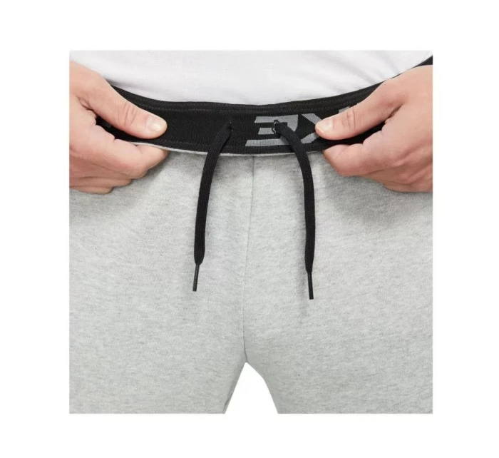 Pánske tréningové nohavice Dri-Fit Trapered M CZ6379-063 sivé - Nike Pánske tréningové nohavice Dri-Fit Trapered M CZ6379-063 sivé - Nike