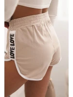 Dámské bavlněné šortky s elastickým pasem a model 21772744 lemem béžové - K-Fashion Dámské bavlněné šortky s elastickým pasem a model 21772744 lemem béžové - K-Fashion