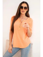 Dámska bavlnená blúzka s dlhými rukávmi a gombíkmi vo výstrihu marhuľová