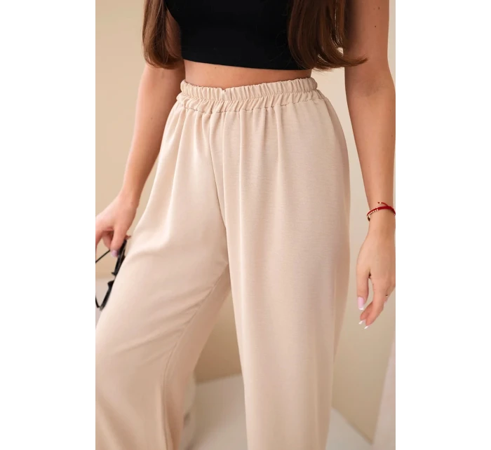 Široké nohavice tmavobéžovej farby