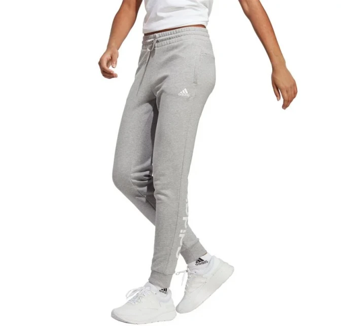 Kalhoty Essentials Linear French Terry Cuffed W model 19688604 dámské - ADIDAS Kalhoty Essentials Linear French Terry Cuffed W model 19688604 dámské - ADIDAS