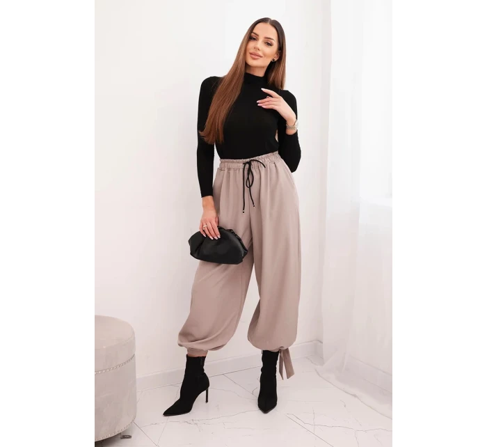 Dámske nohavice so širokými nohavicami a spodným viazaním fango Dámske nohavice so širokými nohavicami a spodným viazaním fango