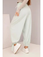 Dámske nohavice so širokými nohavicami a viazaním v spodnej časti tmavá mentolová