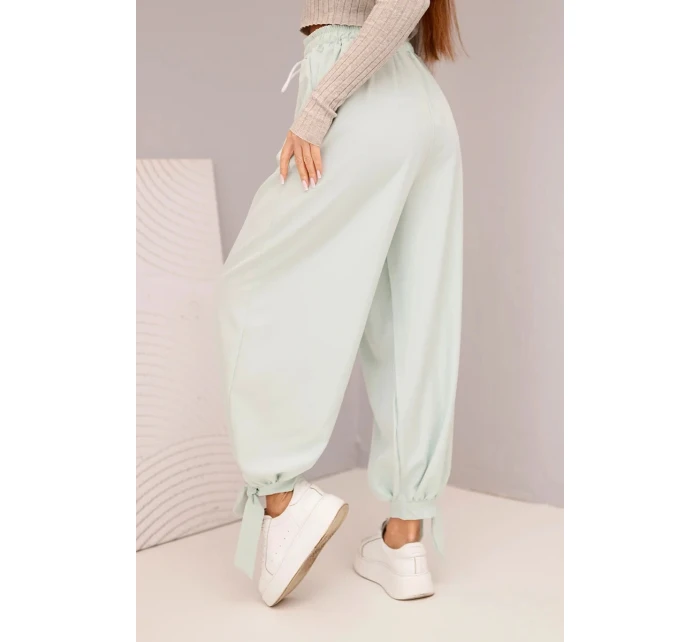 Dámske nohavice so širokými nohavicami a viazaním v spodnej časti tmavá mentolová