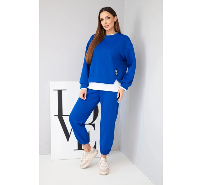 Dámský komplet s s volnou mikinou a tepláky modrý model 21808627 - K-Fashion Dámský komplet s s volnou mikinou a tepláky modrý model 21808627 - K-Fashion