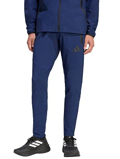 Pánské kalhoty Tiro 26 Travel Woven navy blue model 22062501 - ADIDAS