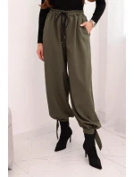 Dámske nohavice so širokými nohavicami a khaki viazaním v spodnej časti Dámske nohavice so širokými nohavicami a khaki viazaním v spodnej časti