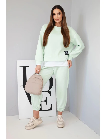 Dámska súprava s maslovou farbou, voľnou mikinou a teplákmi svetlej mentolovej farby Dámska súprava s maslovou farbou, voľnou mikinou a teplákmi svetlej mentolovej farby