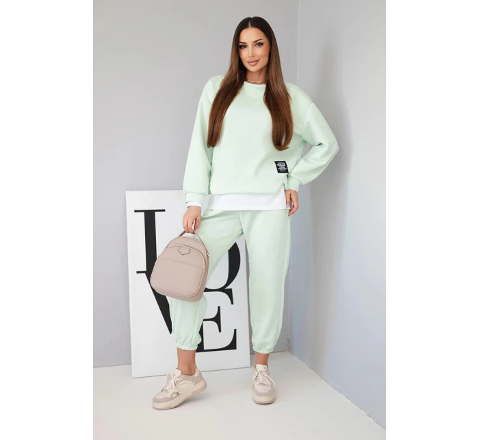 Dámska súprava s maslovou farbou, voľnou mikinou a teplákmi svetlej mentolovej farby Dámska súprava s maslovou farbou, voľnou mikinou a teplákmi svetlej mentolovej farby