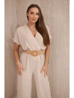Kombinéza s ozdobným pásom béžová Kombinéza s ozdobným pásom béžová