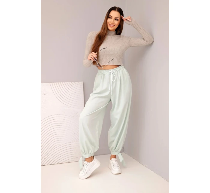 Dámske nohavice so širokými nohavicami a viazaním v spodnej časti tmavá mentolová