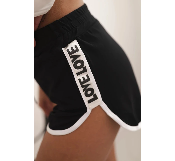 Dámské bavlněné šortky s elastickým pasem a model 21772746 lemem černé - K-Fashion Dámské bavlněné šortky s elastickým pasem a model 21772746 lemem černé - K-Fashion