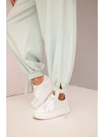 Dámske nohavice so širokými nohavicami a viazaním v spodnej časti tmavá mentolová