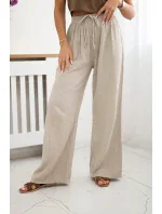 Široké mušelínové nohavice béžovej farby