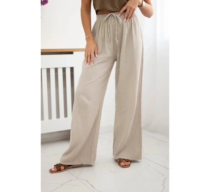 Široké mušelínové nohavice béžovej farby