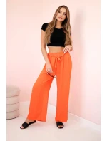 Široké nohavice v páse tmavo oranžové Široké nohavice v páse tmavo oranžové
