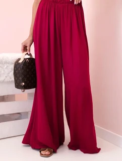 Dámske viskózové nohavice so širokými nohavicami a elastickým pásom tmavo vínovej farby