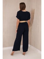 Kombinéza s ozdobným opaskom v páse námornícka farba Kombinéza s ozdobným opaskom v páse námornícka farba