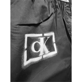 Pánske nohavice na spanie NM2390E B88 čierna s potlačou - Calvin Klein