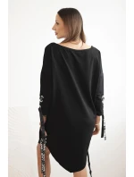 Dámske asymetrické šaty s ozdobnými pásmi a 3/4 rukávmi modrej farby Dámske asymetrické šaty s ozdobnými pásmi a 3/4 rukávmi modrej farby