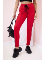 Dámske tepláky s opaskom a šnúrkou na stiahnutie červené