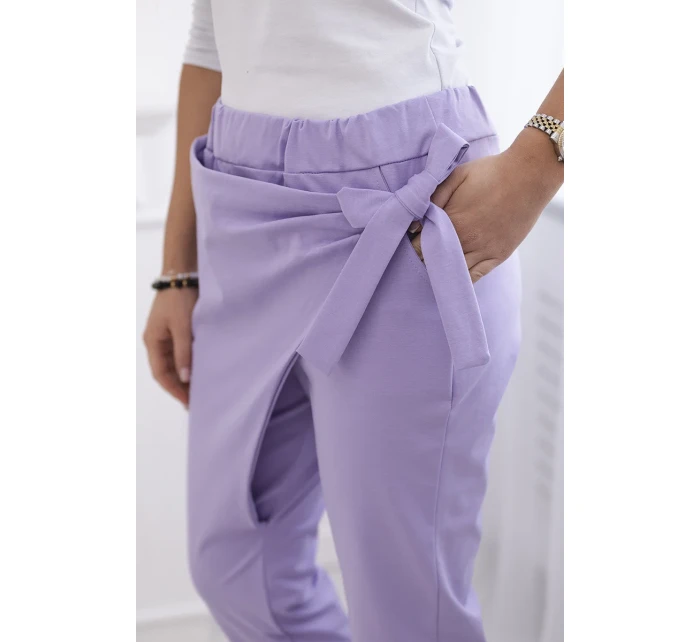 Nohavice s asymetrickou prednou časťou svetlo fialové