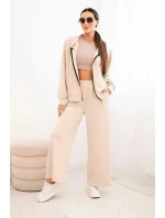 Dámska maslová súprava so širokými nohavicami a mikinou na zips béžová Dámska maslová súprava so širokými nohavicami a mikinou na zips béžová