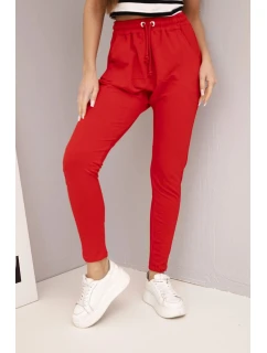 Dámske tepláky s elastickým pásom a šnúrkou na stiahnutie červené