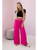 Nohavice so širokým elastickým pásom fuchsiovej farby
