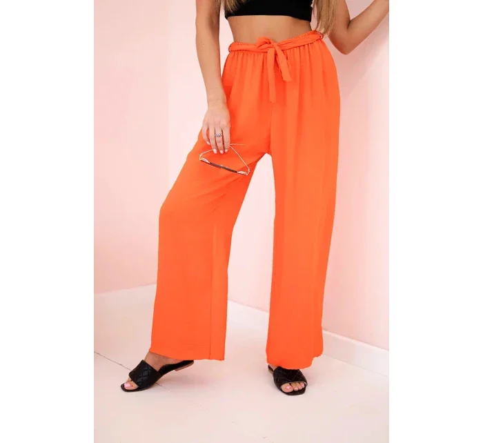 Široké nohavice v páse tmavo oranžové Široké nohavice v páse tmavo oranžové