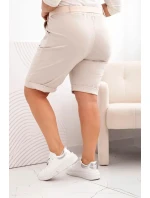 Dámske bavlnené šortky s opaskom v béžovej farbe Dámske bavlnené šortky s opaskom v béžovej farbe