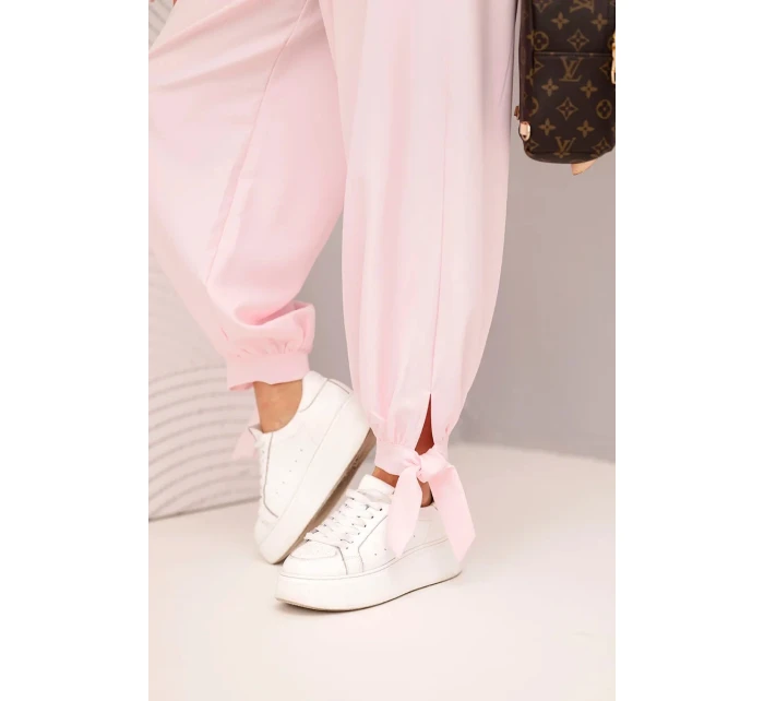 Dámske nohavice so širokými nohavicami a viazaním v spodnej časti candy pink