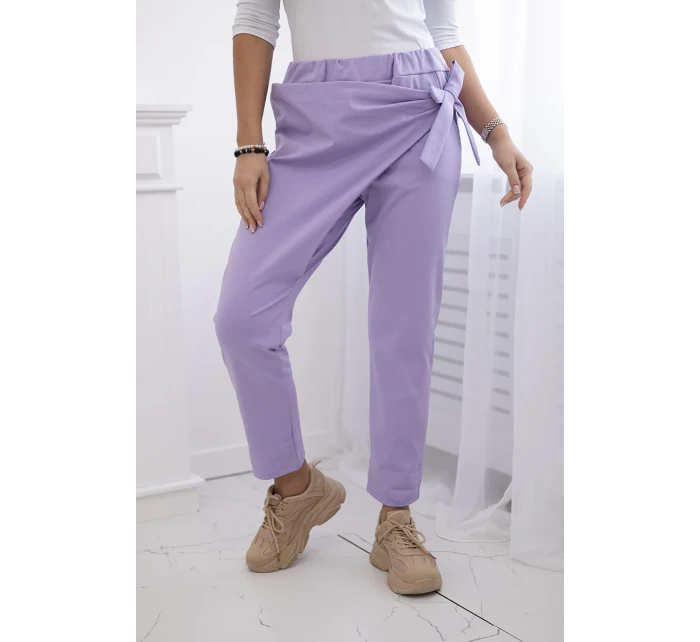 Nohavice s asymetrickou prednou časťou svetlo fialové