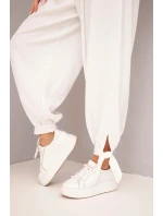 Dámské kalhoty s širokým nohavicí a vázáním dole bílé