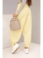 Dámske nohavice so širokými nohavicami a viazaním v spodnej časti žltej farby