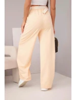 Dámske bavlnené nohavice so širokými nohavicami a opaskom marhuľová