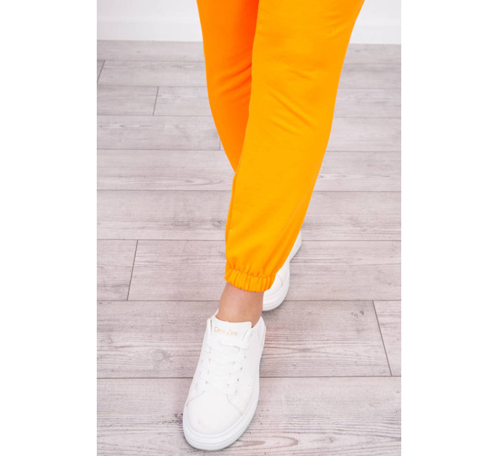 Bavlněné kalhoty oranžové neonové