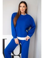 Dámský komplet s s volnou mikinou a tepláky modrý model 21808627 - K-Fashion Dámský komplet s s volnou mikinou a tepláky modrý model 21808627 - K-Fashion