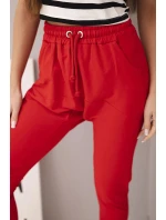 Dámske tepláky s elastickým pásom a šnúrkou na stiahnutie červené Dámske tepláky s elastickým pásom a šnúrkou na stiahnutie červené
