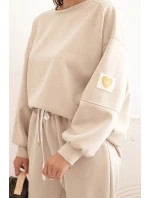Dámska maslová súprava s voľnou mikinou a nohavicami LOVE beige Dámska maslová súprava s voľnou mikinou a nohavicami LOVE beige