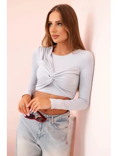 Dámska blúzka s dlhými rukávmi a ozdobnými volánikmi na hrudi sivá