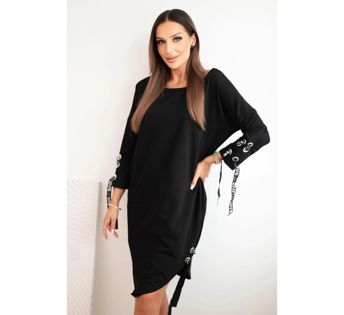 Dámske asymetrické šaty s ozdobnými pásmi a 3/4 rukávmi modrej farby Dámske asymetrické šaty s ozdobnými pásmi a 3/4 rukávmi modrej farby