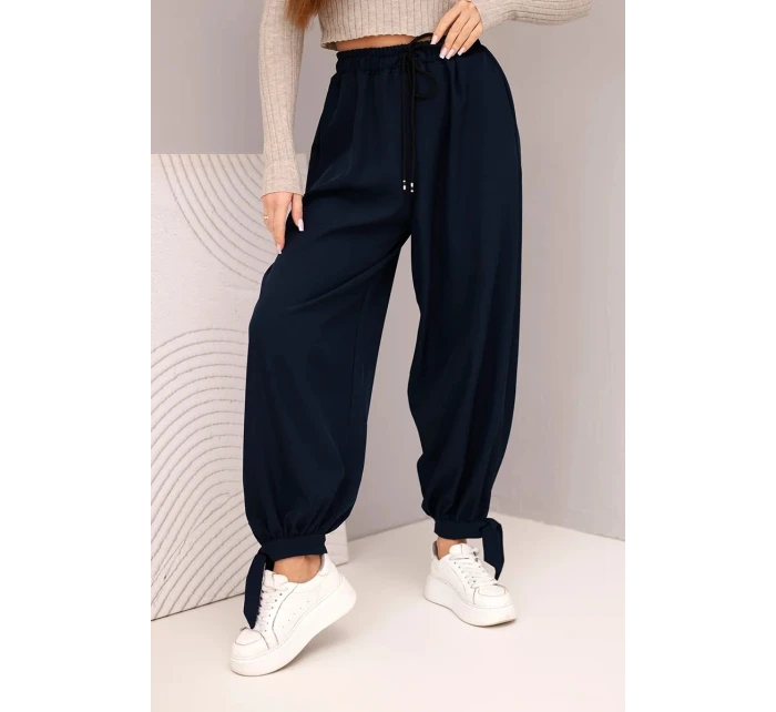 Dámske nohavice so širokými nohavicami a viazaním v spodnej časti modrej farby