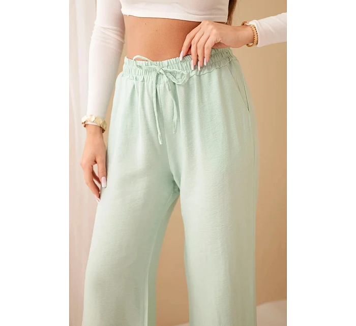 Viskózové nohavice so širokými nohavicami mätovej farby