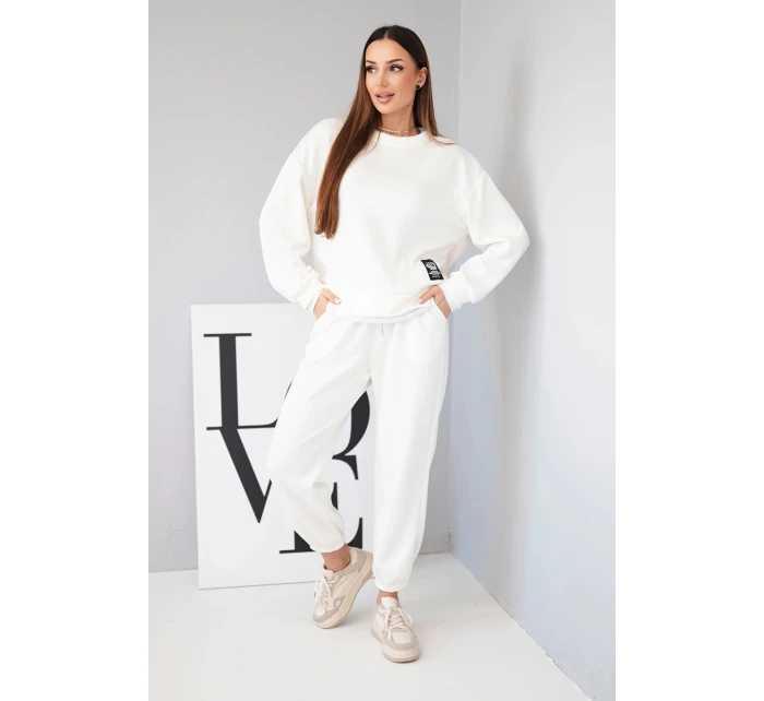 Dámský komplet s model 21808641 volnou mikinou a tepláky ecru - K-Fashion Dámský komplet s model 21808641 volnou mikinou a tepláky ecru - K-Fashion