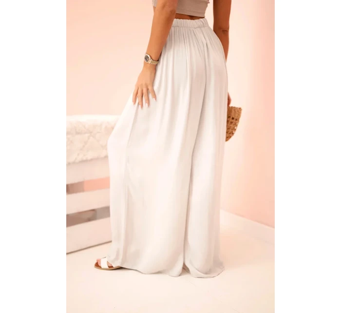 Dámske široké viskózové nohavice s elastickým pásom béžovej farby Dámske široké viskózové nohavice s elastickým pásom béžovej farby